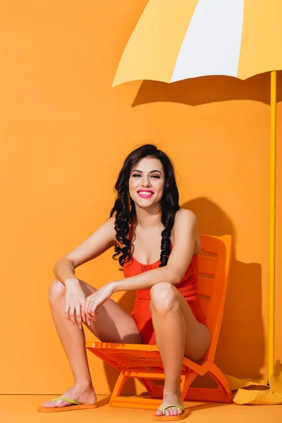 Happy Girl Swimwear Sitting Deck Chair Paper Cut Umbrella Orange — Stock Photo, Image