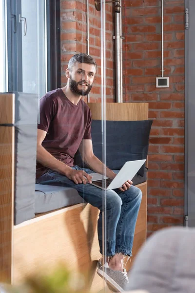 Selective Focus Bearded Businessman Sitting Window Bench Holding Modern Laptop — Stock Photo, Image