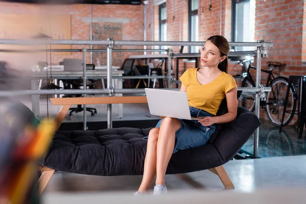 Selective Focus Pensive Businesswoman Looking Away While Sitting Laptop Sofa — Stock Photo, Image