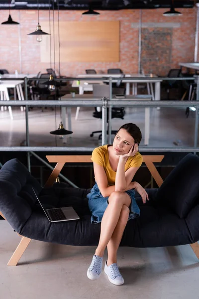 Pensive Businesswoman Looking Away While Sitting Laptop Sofa Office — Stock Photo, Image