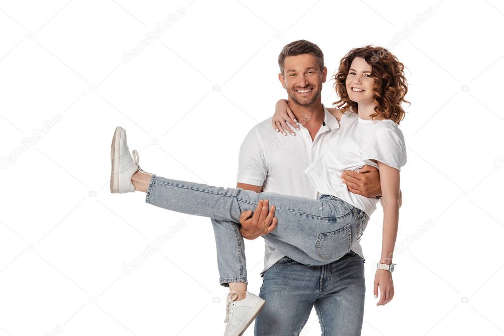 cheerful man holding in arms curly wife isolated on white 