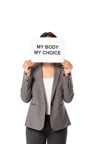 businesswoman covering face while holding placard with my body my choice lettering isolated on white