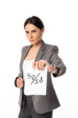 beautiful businesswoman in suit holding paper with fifty-fifty symbols isolated on white, gender equality concept clipart