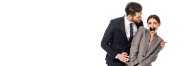 Resmi olarak işadamlarının web sitesi başlığı, beyaz ağzında koli bandıyla iş kadınını taciz ediyor.