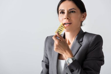 businesswoman taking off scotch tape and breathing isolated on white, sexism concept  clipart
