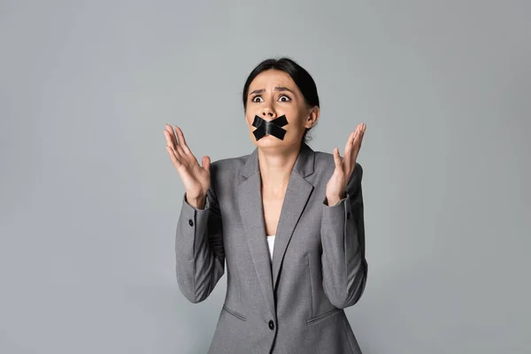 Emotional Businesswoman Scotch Tape Mouth Gesturing Isolated Grey — Stock Photo, Image