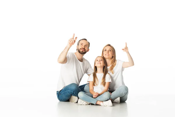 Happy Family Sitting Floor Crossed Legs Pointing Isolated White — Stock Photo, Image