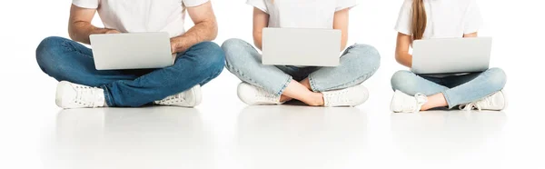 Cropped View Family Sitting Floor Laptops Crossed Legs White Panoramic — Stock Photo, Image