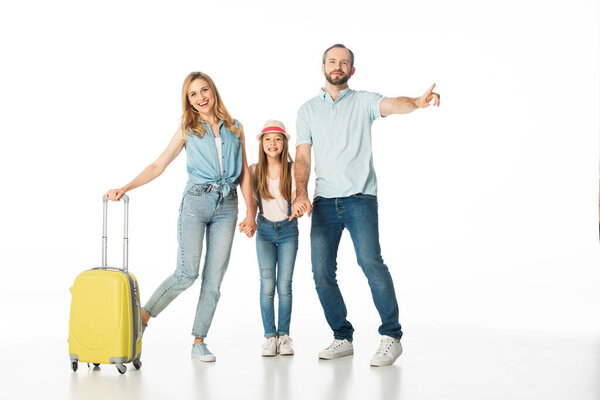 happy family with travel bag isolated on white
