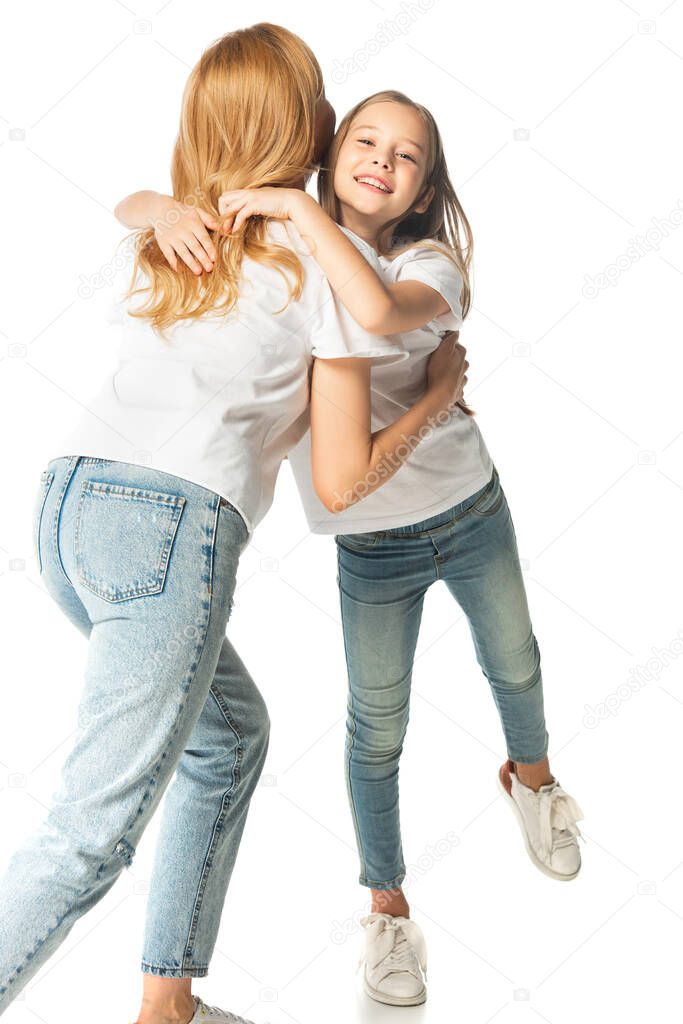 happy daughter hugging mother isolated on white