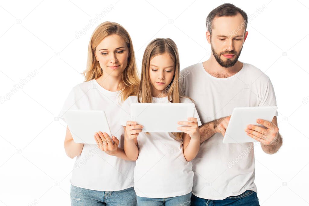 family in white t-shirts using digital tablets isolated on white