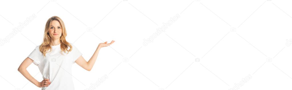 attractive adult woman pointing with hand aside isolated on white, panoramic shot