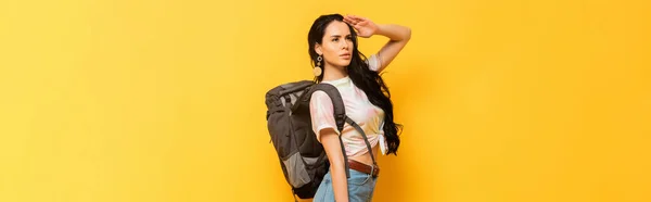 Brunette Woman Backpack Looking Away Yellow Background Panoramic Shot — Stock Photo, Image