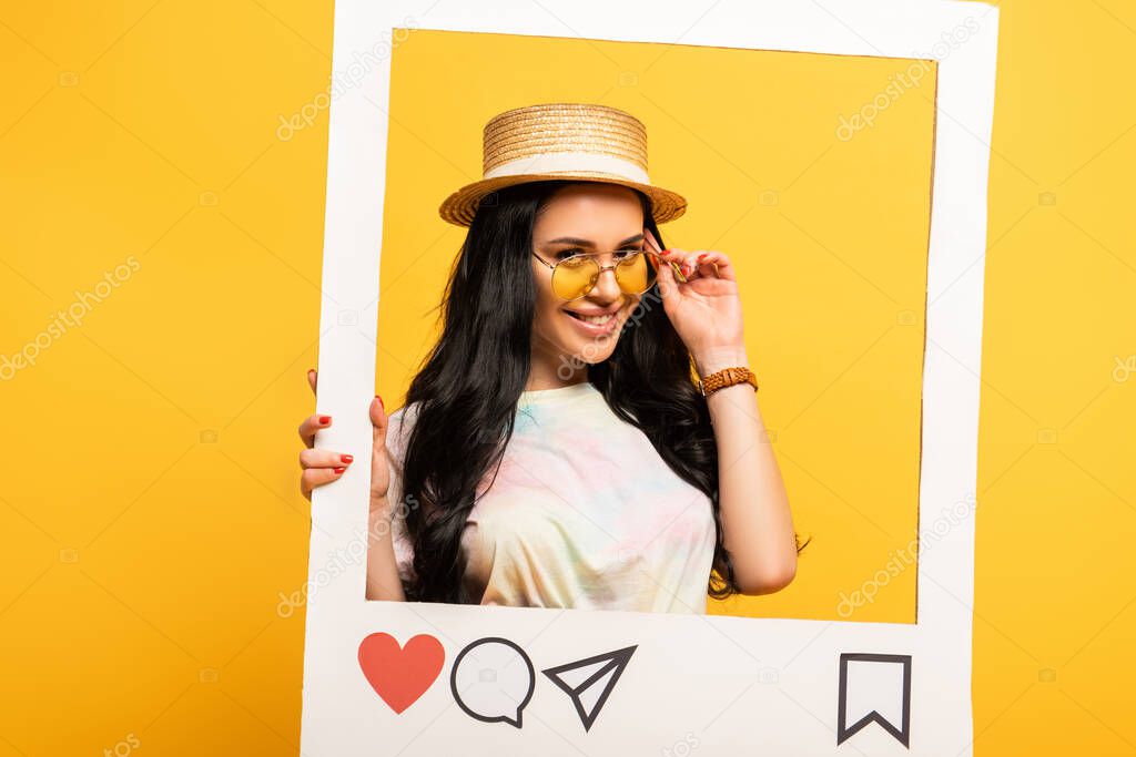 smiling brunette girl in summer outfit posing in social network frame on yellow background