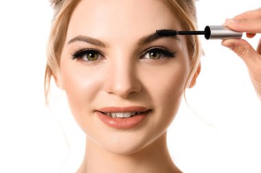 Beyaz tenli, güzel sarışın bir kadının yanında maskaralı bir el.