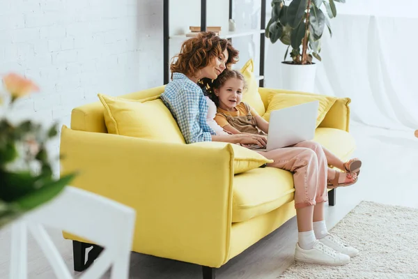 Selective Focus Young Nanny Cute Kid Using Laptop While Sitting — Stock Photo, Image