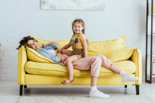 Happy Child Sitting Lying Nanny While Having Fun Sofa Looking — Stock Photo, Image
