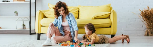 Panoramic Concept Young Babysitter Adorable Kid Playing Multicolored Blocks Floor — Stock Photo, Image