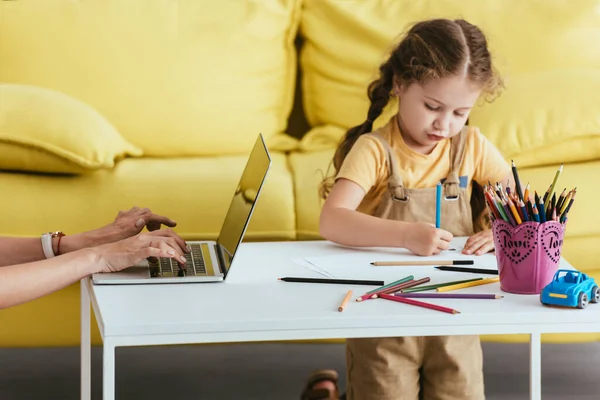 Cropped View Babysitter Working Laptop Cute Child Drawing Pencils — Stock Photo, Image