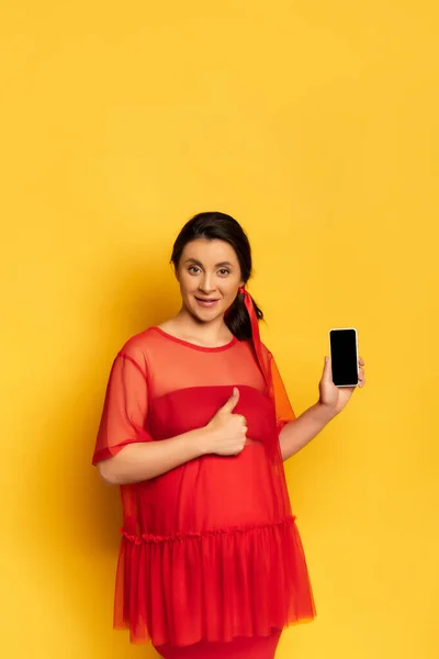 Pregnant Woman Red Outfit Showing Thumb While Holding Smartphone Blank — Stock Photo, Image