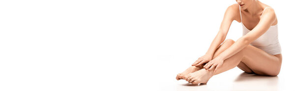 panoramic crop of woman with perfect body sitting on white