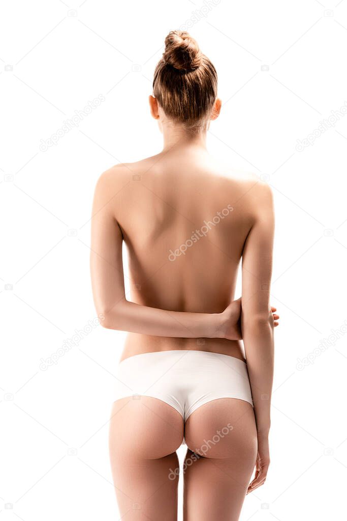 back view of woman in panties standing with arms behind back isolated on white