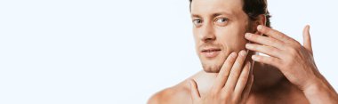 Horizontal image of shirtless man touching skin on cheek isolated on white clipart