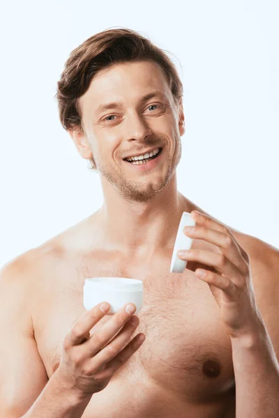 Homem Sem Camisa Segurando Frasco Creme Cosmético Olhando Para Câmera — Fotografia de Stock