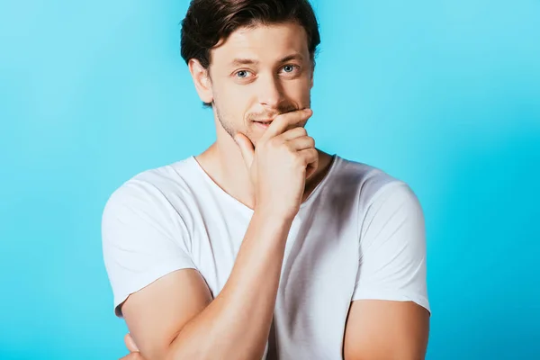 Young Man Hand Chin Looking Camera Blue Background — Stock Photo, Image