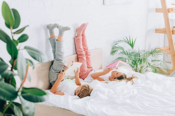 Selective Focus Brother Sister Pajamas Reading Books While Lying Legs — Stock Photo, Image