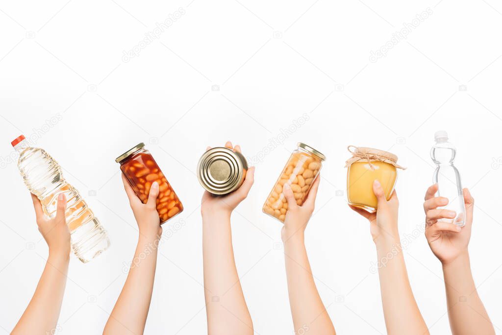 cropped view of woman hands with food isolated on white, charity concept