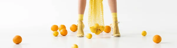 Cropped View Female Legs Yellow Socks Sandals String Bag Scattered — Stock Photo, Image