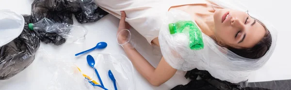 Panoramic Shot Woman Plastic Bag Head Closed Eyes Sitting Empty — Stock Photo, Image