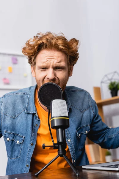 Tense Redhead Announcer Denim Shirt Speaking Microphone Workplace — Stock Photo, Image