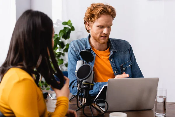 Brunette Woman Touching Hair While Sitting Microphone Redhead Radio Host — Stock Photo, Image