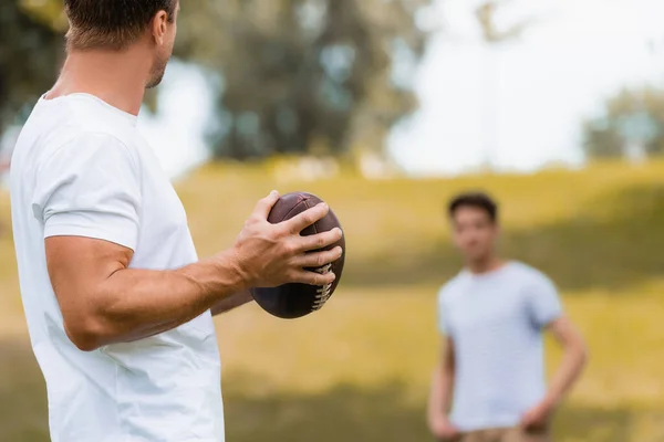 Selective Focus Man Holding Rugby Ball Teenager Son Green Park — Stock Photo, Image