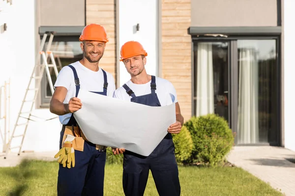 Builders Blueprint Looking Camera Lawn Building — Stock Photo, Image