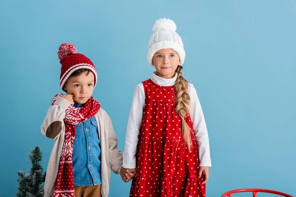 Boy Knitted Hat Scarf Touching Cheek While Holding Hands Sister — Stock Photo, Image