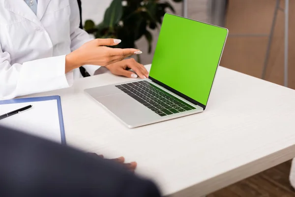 Cropped View Doctor Pointing Hand Laptop Green Screen Patient Workplace — Stock Photo, Image