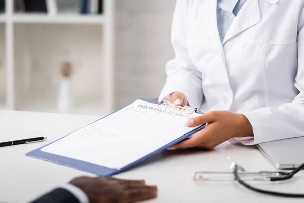 Cropped View Doctor Holding Clipboard Insurance Claim Form African American — Stock Photo, Image