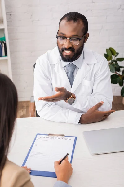 Selective Focus African American Doctor Eyeglasses Pointing Hand Patient Signing — Stock Photo, Image