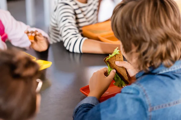 Selective Focus Schoolboy Holding Sandwich Lettuce Classmates School Canteen — Stock Photo, Image