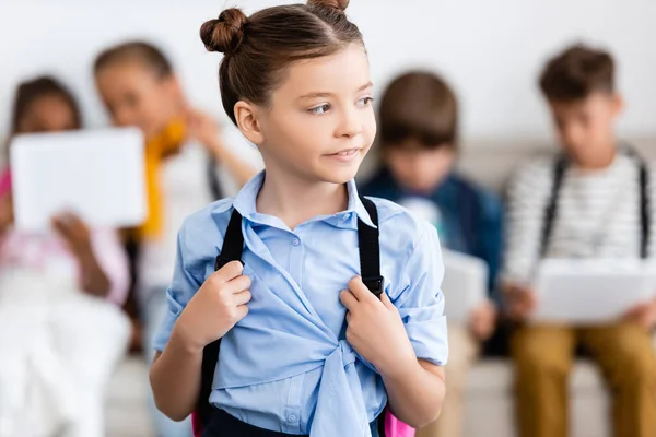 Selective Focus Schoolgirl Holding Backpack Multiethnic Friends Background — Stock Photo, Image