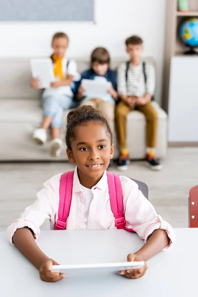 Selective Focus African American Schoolgirl Backpack Holding Digital Tablet Desk — Stock Photo, Image
