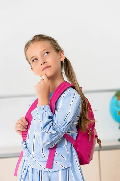 Dreamy Schoolgirl Backpack Looking Away Classroom — Stock Photo, Image