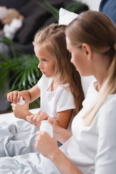 Selective Focus Sick Kid Opening Jar Pills Mother Bed — Stock Photo, Image