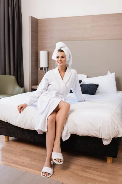 Joyful Woman Towel White Bathrobe Sitting Bed Hotel Room — Stock Photo, Image