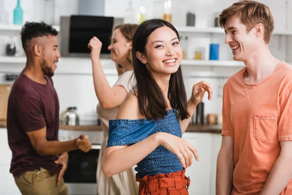 Excited Asian Woman Looking Camera While Dancing Multicultural Friends — Stock Photo, Image