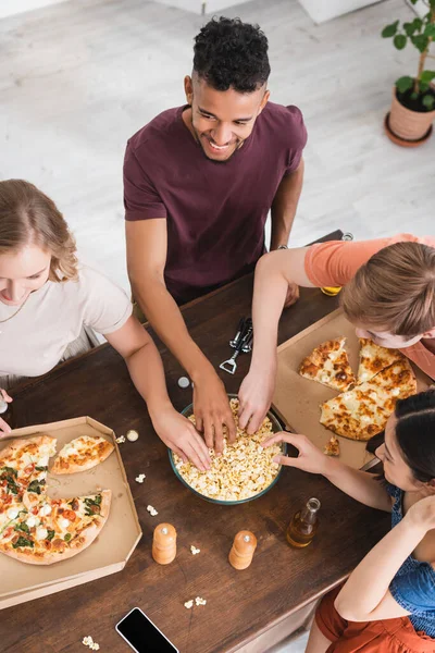 Overhead View Multicultural Friends Taking Popcorn Pizza Table — Stock Photo, Image