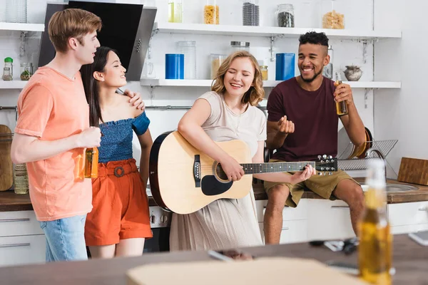 Selective Focus Young Woman Playing Guitar Excited Multicultural Friends — Stock Photo, Image